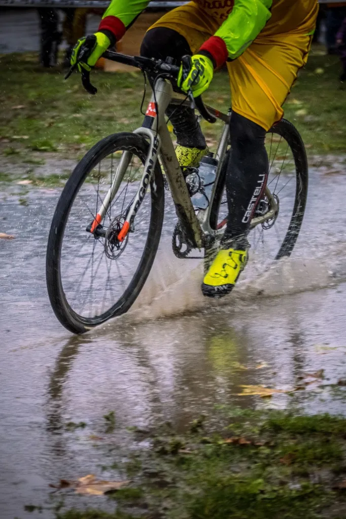 Road bike crossing a puddle